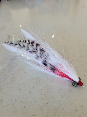 An all white version with grizzly hackles and bleeding gills