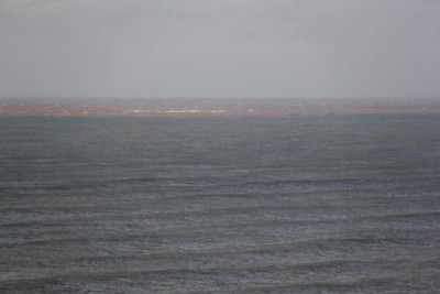 view to North West Reef from Lighthouse showing chocolate tide line post cyclone
